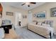 Comfortable bedroom with a daybed, neutral walls, and view of bathroom at 6567 American Eagle Ave, Las Vegas, NV 89131