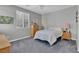 Bedroom featuring a ceiling fan, window and carpeted floor at 6567 American Eagle Ave, Las Vegas, NV 89131