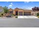 Beautiful single-story home featuring a stone facade, tiled roof, and a well-manicured front yard at 6567 American Eagle Ave, Las Vegas, NV 89131