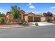Well-maintained home with a three-car garage, desert landscaping, and a charming stone accent wall at 6567 American Eagle Ave, Las Vegas, NV 89131