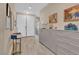 Stylish foyer with tile flooring and built in storage leads to the home's living spaces at 6567 American Eagle Ave, Las Vegas, NV 89131