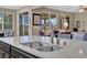 Granite counters and stainless steel double sinks in this gorgeous kitchen at 6567 American Eagle Ave, Las Vegas, NV 89131