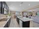 Open kitchen view with island, stainless appliances, and access to the dining area at 6567 American Eagle Ave, Las Vegas, NV 89131