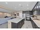 Modern kitchen with island seating, dark cabinets, and open concept layout at 6567 American Eagle Ave, Las Vegas, NV 89131