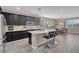 Spacious kitchen with black cabinets, a large island, and stainless steel appliances at 6567 American Eagle Ave, Las Vegas, NV 89131
