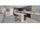 Kitchen with granite countertops, island with seating, and stainless steel appliances at 6567 American Eagle Ave, Las Vegas, NV 89131