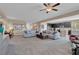 Spacious open-concept living room with seamless flow to the kitchen, showcasing a modern and inviting layout at 6567 American Eagle Ave, Las Vegas, NV 89131