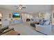 Inviting living room with plush seating, custom built ins and natural lighting, perfect for relaxation and entertainment at 6567 American Eagle Ave, Las Vegas, NV 89131