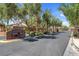 Inviting community entrance with stone signage and mature trees enhancing the neighborhood's appeal at 6567 American Eagle Ave, Las Vegas, NV 89131