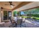 Relaxing covered patio with outdoor seating and a well-maintained garden view at 6567 American Eagle Ave, Las Vegas, NV 89131