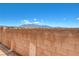 Backyard with brick perimeter wall and mountain view at 6622 Colorado Spruce St, Las Vegas, NV 89149