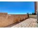 Backyard features perimeter brick wall, mountain view, and some greenery at 6622 Colorado Spruce St, Las Vegas, NV 89149