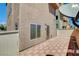 Exterior view of patio with tiled ground, window, and satellite dish at 6622 Colorado Spruce St, Las Vegas, NV 89149