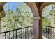 Close-up view from balcony with textured archway overlooking foliage at 6622 Colorado Spruce St, Las Vegas, NV 89149