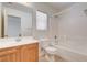 Bathroom with a shower and tub combination and a wooden vanity with sink and mirror at 6622 Colorado Spruce St, Las Vegas, NV 89149