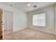 Bright bedroom with neutral carpet, natural light from window, and easy access to closet and hallway at 6622 Colorado Spruce St, Las Vegas, NV 89149