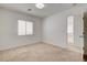 Well-lit bedroom with plush carpet floors, large window, and a walk-in closet at 6622 Colorado Spruce St, Las Vegas, NV 89149