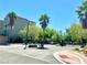 Gated community entrance with palm trees, landscaping, and well-maintained surroundings at 6622 Colorado Spruce St, Las Vegas, NV 89149