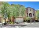 Charming two-story home featuring a stucco facade, with a two-car garage, and manicured front yard at 6622 Colorado Spruce St, Las Vegas, NV 89149