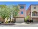 Charming two-story home with stucco exterior, attached garage, and mature landscaping at 6622 Colorado Spruce St, Las Vegas, NV 89149