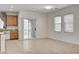 Open-concept living space with tiled flooring, an eat-in kitchen, and ample natural light at 6622 Colorado Spruce St, Las Vegas, NV 89149