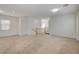Large carpeted living area featuring neutral walls, recessed lighting, and staircase access at 6622 Colorado Spruce St, Las Vegas, NV 89149