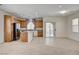 Inviting open-concept living area with tile flooring, an eat-in kitchen, and natural light at 6622 Colorado Spruce St, Las Vegas, NV 89149