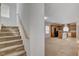 Carpeted staircase leads to the second floor near the kitchen and living room at 6622 Colorado Spruce St, Las Vegas, NV 89149
