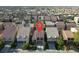 Aerial view of a home with a terra cotta roof in a planned community at 6726 Glissando Ct, Las Vegas, NV 89139
