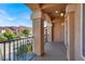 This outdoor balcony provides a cozy space with views of the surrounding neighborhood and blue skies at 6726 Glissando Ct, Las Vegas, NV 89139