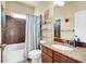 This bathroom offers a tub and shower with marble style accent and a large single sink at 6726 Glissando Ct, Las Vegas, NV 89139