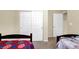Bright bedroom with twin beds and carpet floors; adjacent storage closet and entry at 6726 Glissando Ct, Las Vegas, NV 89139