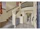 Inviting entryway featuring stairs, tile flooring, and a view of the open-concept living space at 6726 Glissando Ct, Las Vegas, NV 89139