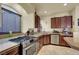 Gourmet kitchen with stainless appliances and granite countertops at 6726 Glissando Ct, Las Vegas, NV 89139
