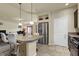Kitchen island with granite countertop and stainless steel appliances at 6726 Glissando Ct, Las Vegas, NV 89139