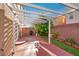 Covered patio is great for outdoor living and entertaining with a lush green landscape at 6726 Glissando Ct, Las Vegas, NV 89139