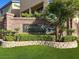 Beautiful sign for Coronado Ranch with stone work and an attractive green manicured yard at 6726 Glissando Ct, Las Vegas, NV 89139