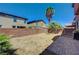 Paver patio area with a bbq grill, surrounded by decorative rock and lush foliage at 7042 Grand Junction Ave, Las Vegas, NV 89179