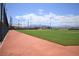 Community baseball field with a well-maintained green lawn and mountain views, perfect for sports enthusiasts at 7042 Grand Junction Ave, Las Vegas, NV 89179