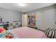 Bedroom featuring natural lighting, plush carpet, and playful accessories at 7042 Grand Junction Ave, Las Vegas, NV 89179