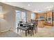 Dining area features sliding glass doors with kitchen access and a view of the yard at 7042 Grand Junction Ave, Las Vegas, NV 89179