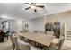 Large dining area featuring a long table, seating for eight, and tile flooring at 7042 Grand Junction Ave, Las Vegas, NV 89179