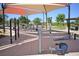 Outdoor fitness center featuring modern workout equipment in a shaded and landscaped community space at 7042 Grand Junction Ave, Las Vegas, NV 89179