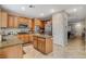 Spacious kitchen with a central island, stainless steel appliances, and abundant cabinetry at 7042 Grand Junction Ave, Las Vegas, NV 89179