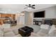 Spacious living room blending seamlessly with the kitchen and dining area at 7042 Grand Junction Ave, Las Vegas, NV 89179