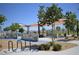 Outdoor community park featuring a colorful playscape and amenities for families to enjoy in a landscaped setting at 7042 Grand Junction Ave, Las Vegas, NV 89179