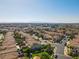 Aerial view of a neighborhood with manicured lawns and a view of the city skyline at 711 Golden Sedum Dr, Henderson, NV 89011