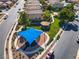 An aerial view showcases a neighborhood park with a playground area, mature trees, landscaping, and walking paths at 711 Golden Sedum Dr, Henderson, NV 89011