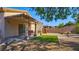 Outdoor living space boasting a covered patio, playhouse, and artificial grass at 711 Golden Sedum Dr, Henderson, NV 89011