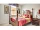 Elegant bedroom with a four-poster bed, decorative pillows, and a classic design at 711 Golden Sedum Dr, Henderson, NV 89011